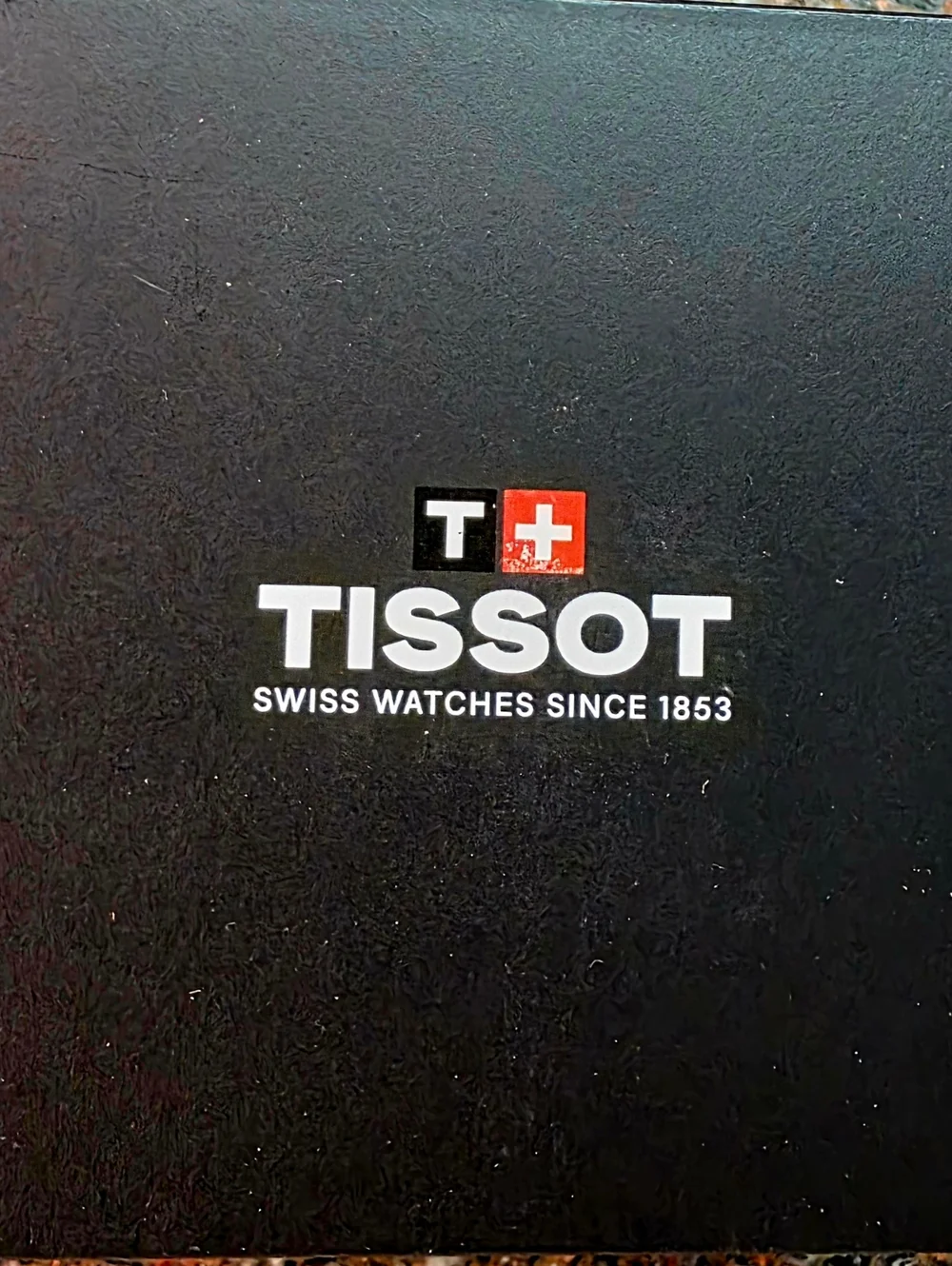 Tissot Silver Watch with Blue Hands and White Dial